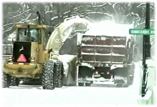John Deere  loader blowing snow